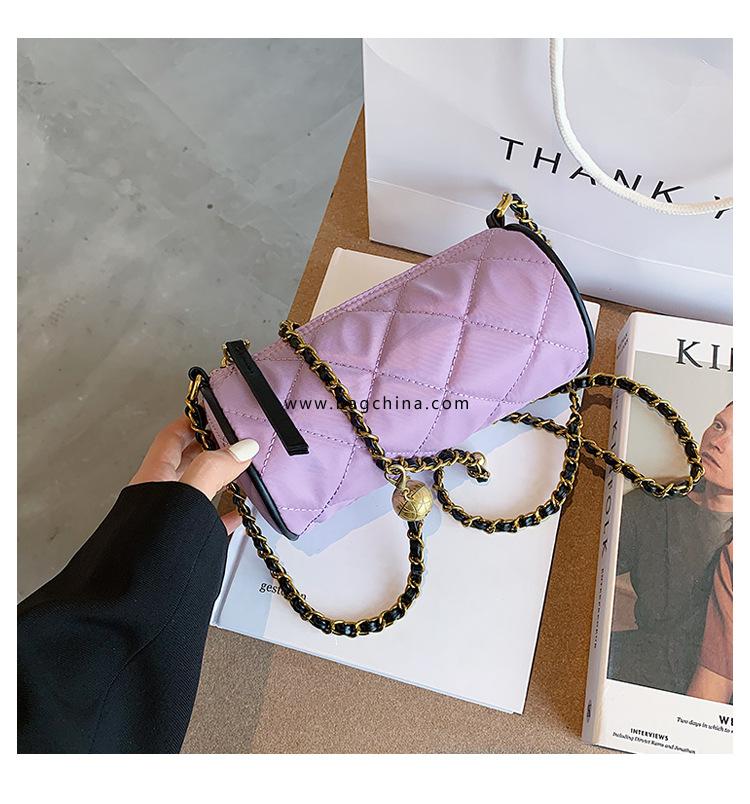 French niche design bag female Ling grid cylinder bag 2020 new tide messenger bag milk tea color canvas armpit bag 