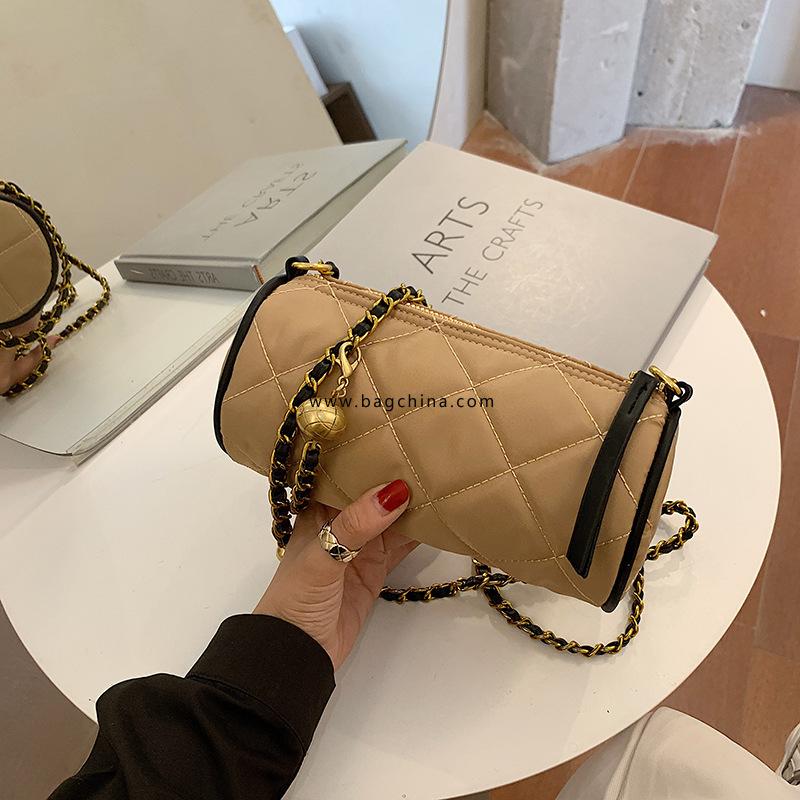 French niche design bag female Ling grid cylinder bag 2020 new tide messenger bag milk tea color canvas armpit bag 